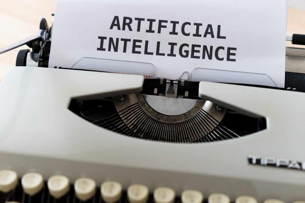 Maquina escrito "inteligência artificial".